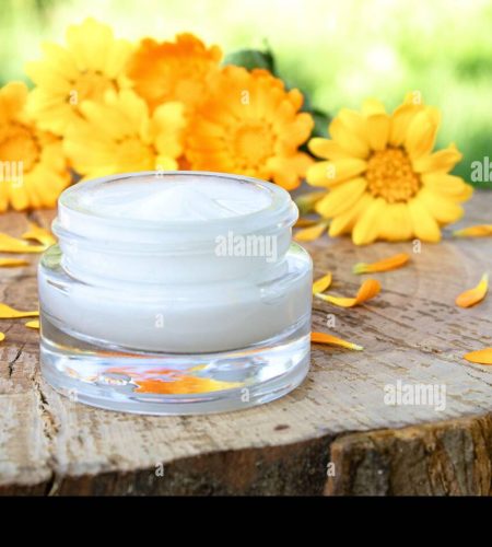 cream-for-body-care-with-calendula-fresh-orange-calendula-flowers-on-a-wooden-background-in-nature-cosmetic-cream-for-cleansing-the-skin-with-calend-2ARG9XX